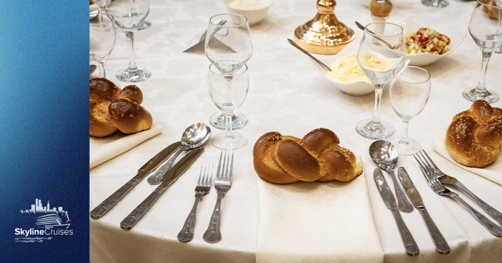 Place settings and challah at the table