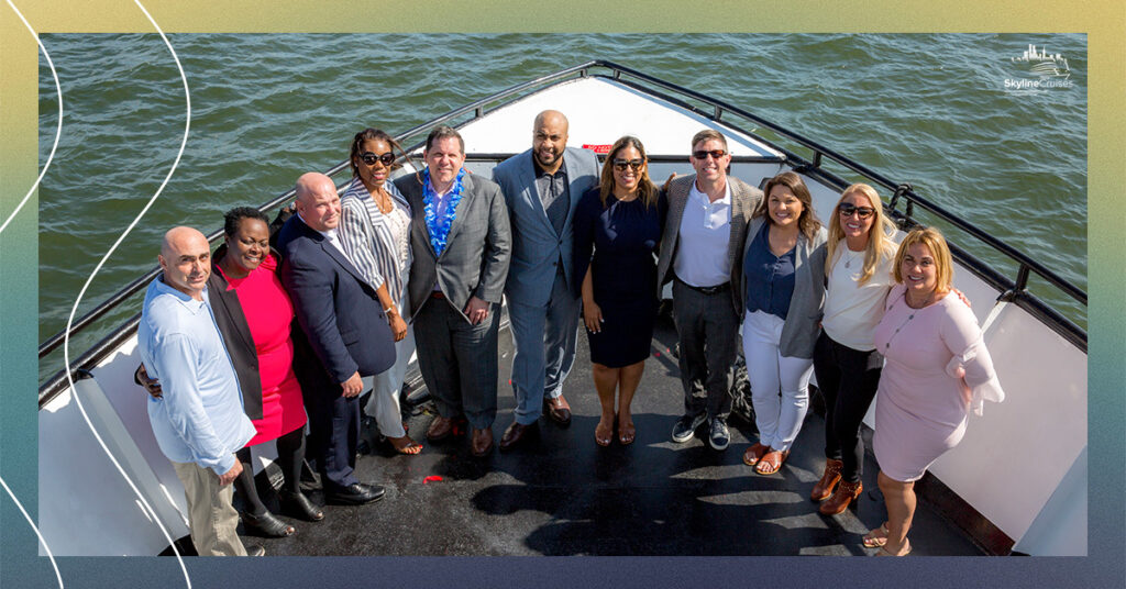Management and team group photo on the front of the boat.